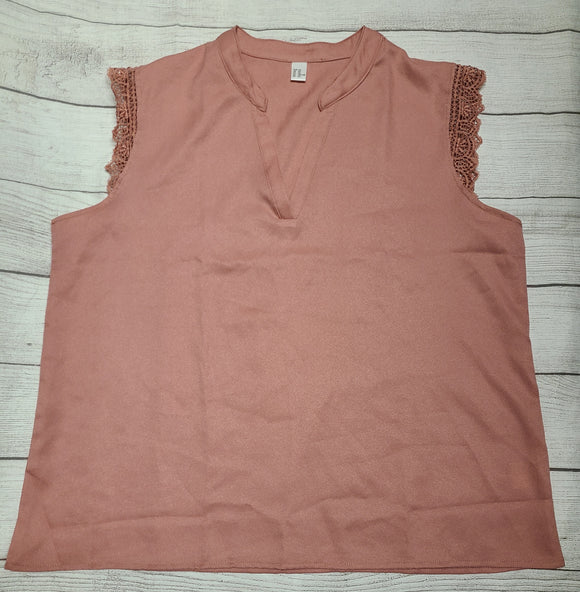 rose colored sleeveless shirt with sleeve detail