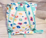 Colorful cheetah and teal back pack