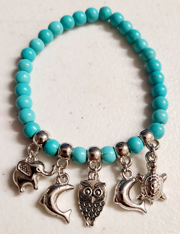 dangle charm bracelet with turquoise stone