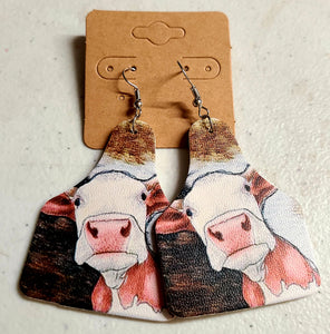 red and white cow earring