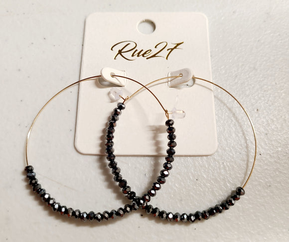 gold earring with gunmetal grey beads