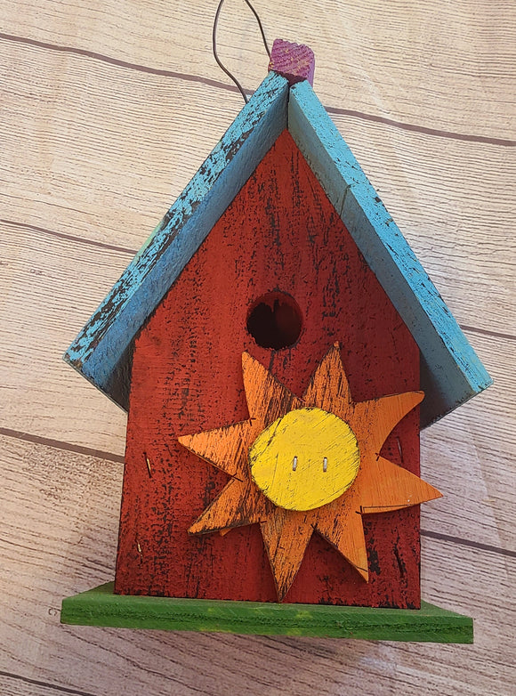 red and purple bird house