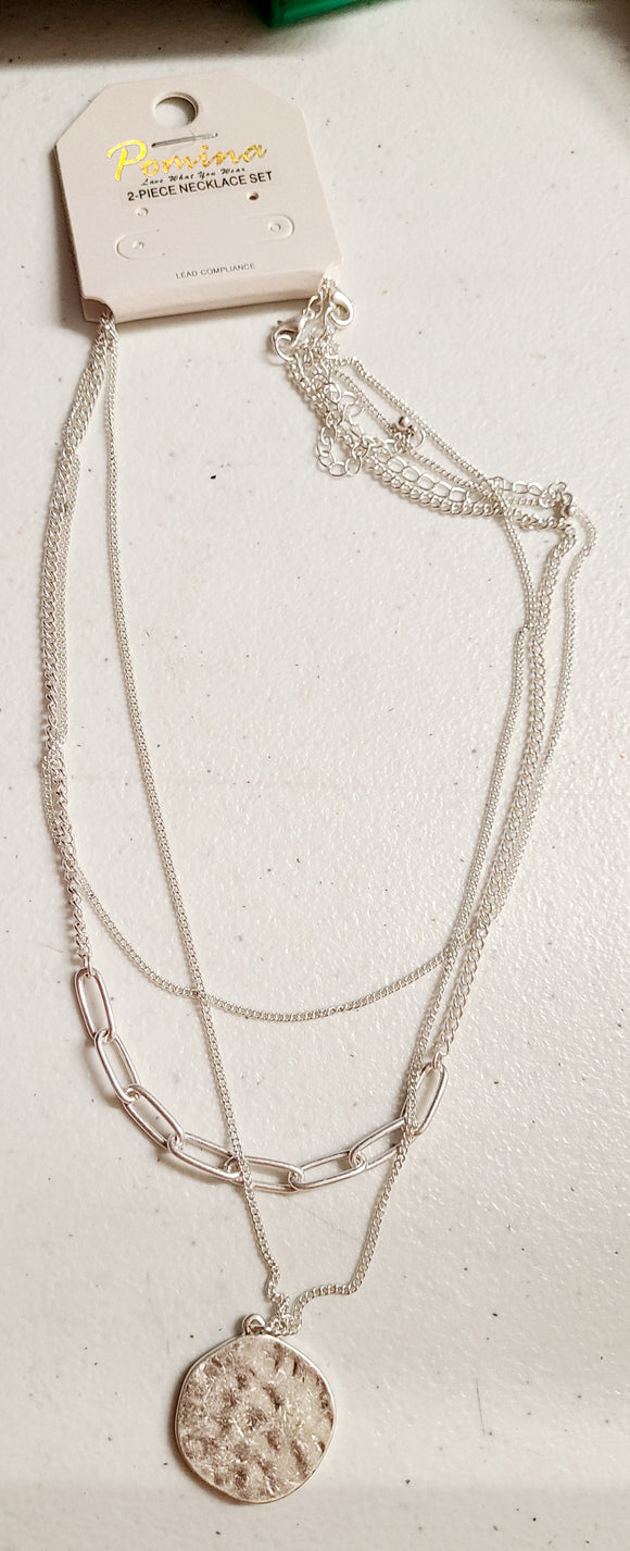 worn silver layered chain and circle 16
