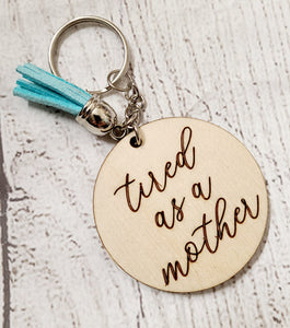 cursive tired as a mother wood keychain