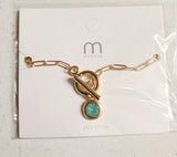 gold chain bracelet with colored stone