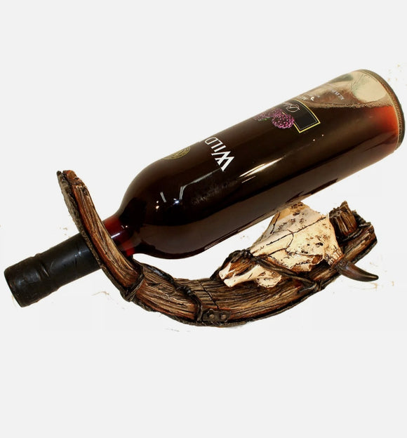 wagon wheel and skull wine holder