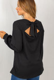 black long sleeve top with sassy back